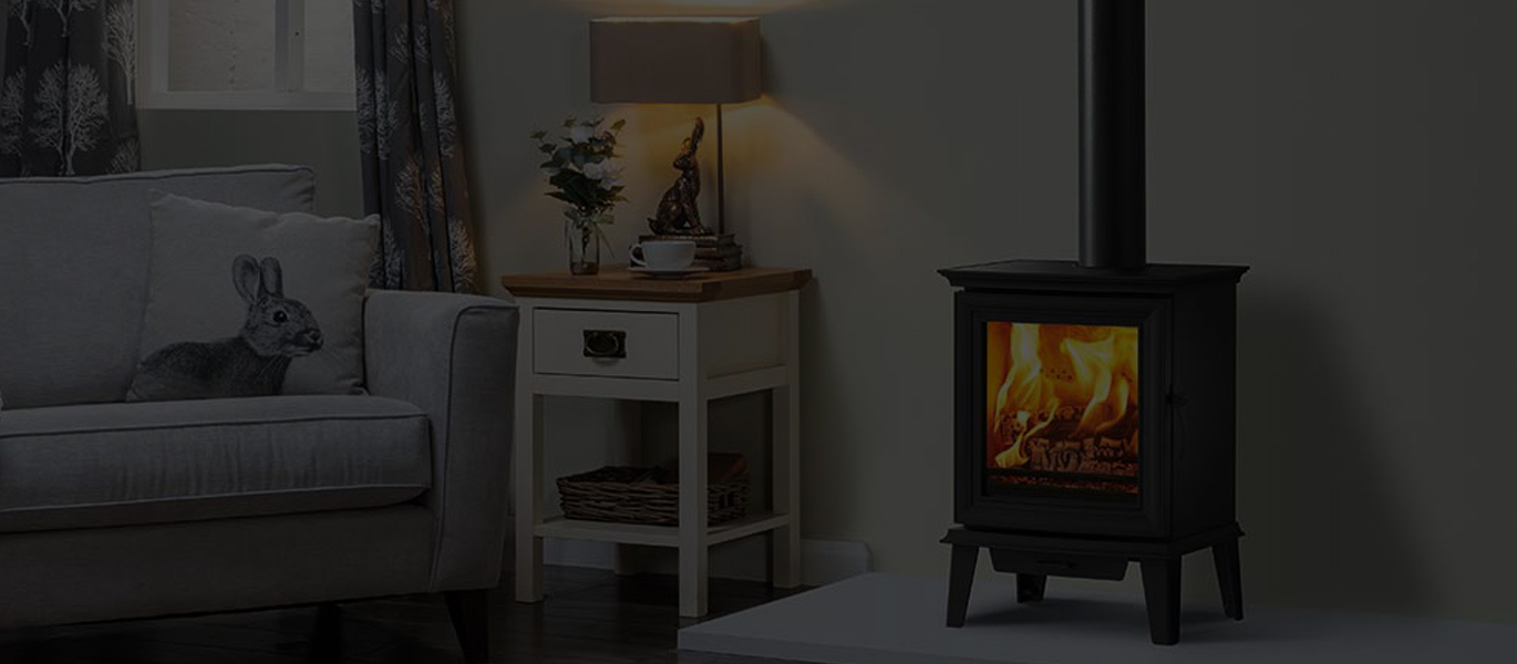 A stove burning in a timber-clad room