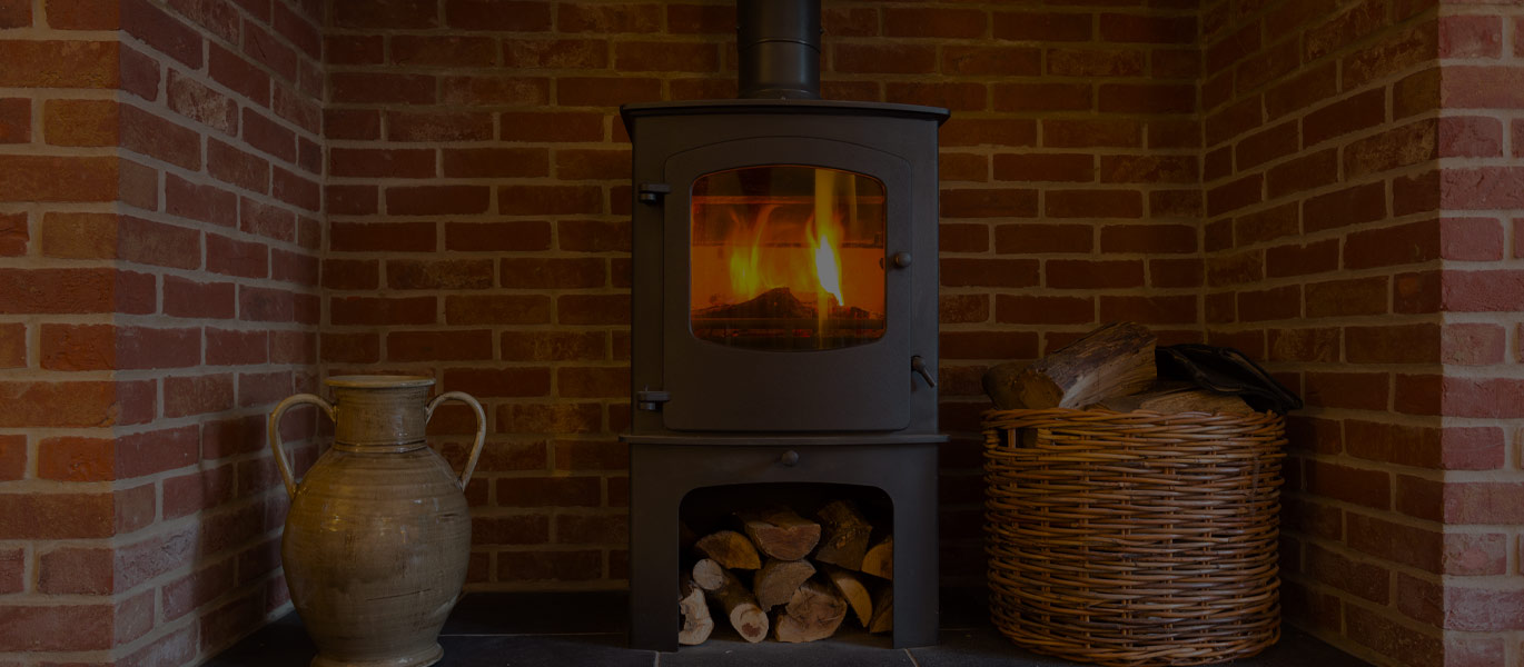A stove in a softly lit living room