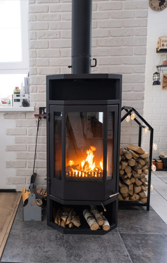 A contemporary wood-burning stove with log store